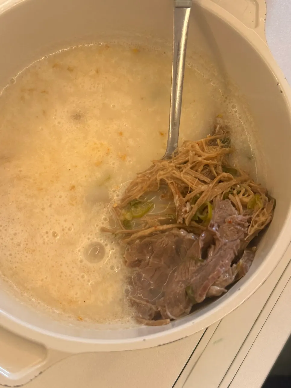 Bone broth soup reheated in a pot
