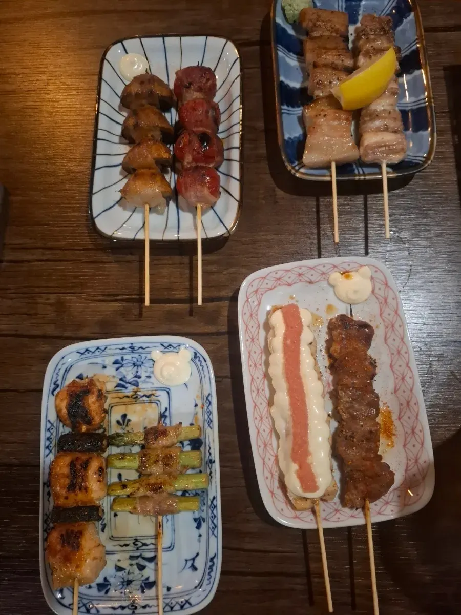 Close-up of yakitori grilled over binchotan charcoal
