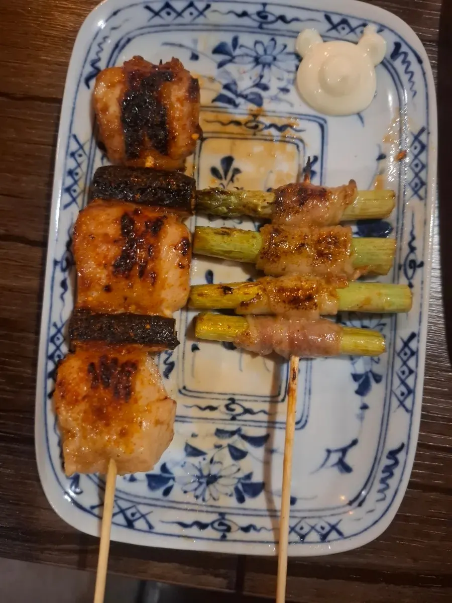 Cross-section of butter-grilled mentaiko split with chopsticks