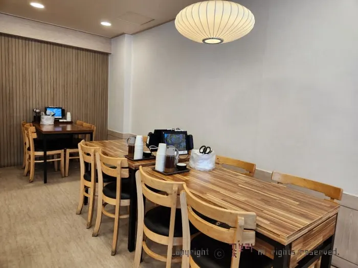 Interior tables and customers at Hoegi Wang Galbitang