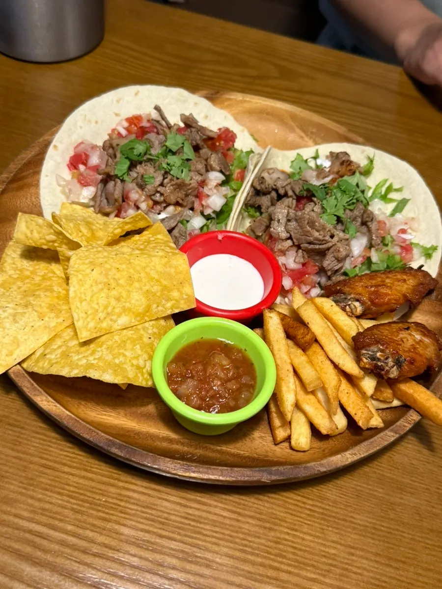 Quesadilla served with sour cream and salsa