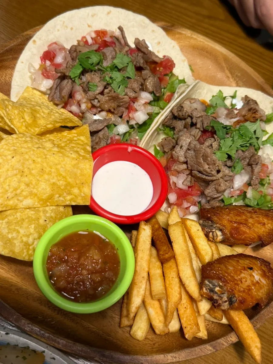 Chicken quesadilla enjoyed with fresh sauce