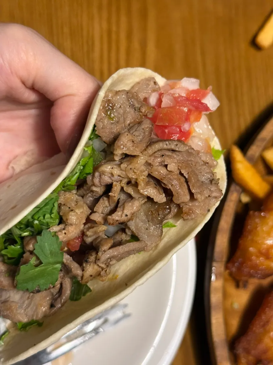 Generously filled grilled beef taco