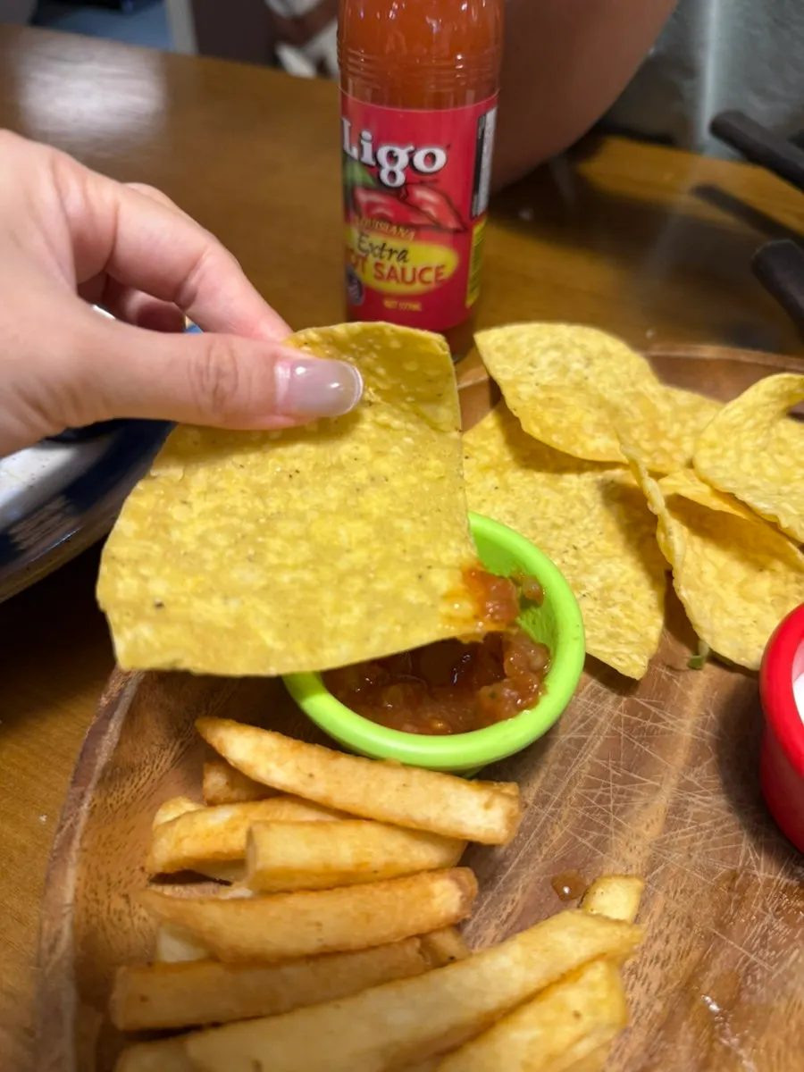 Taco with beef, vegetables, and tomatoes