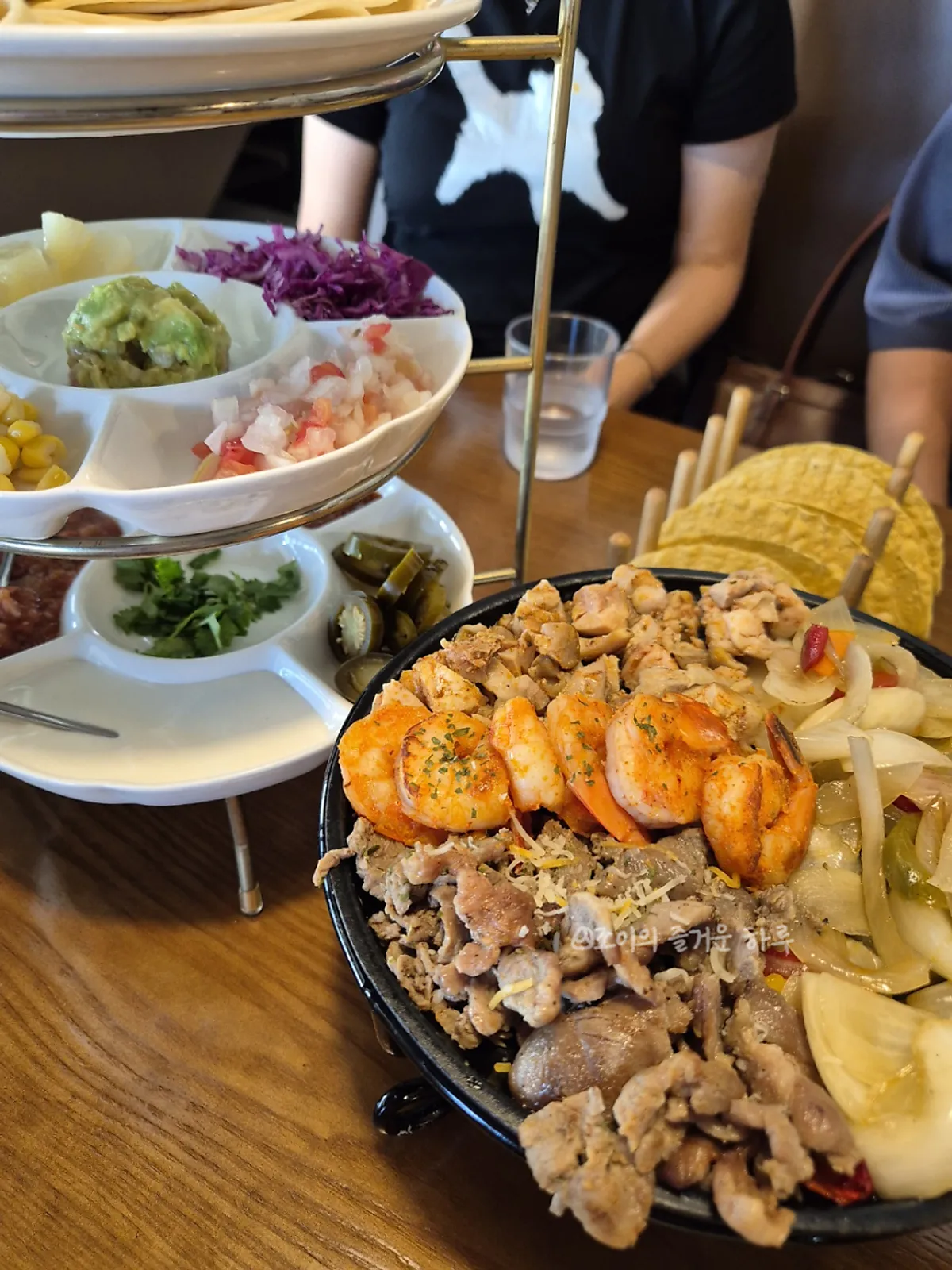 A spread of fajita, chimichanga, and quesadilla
