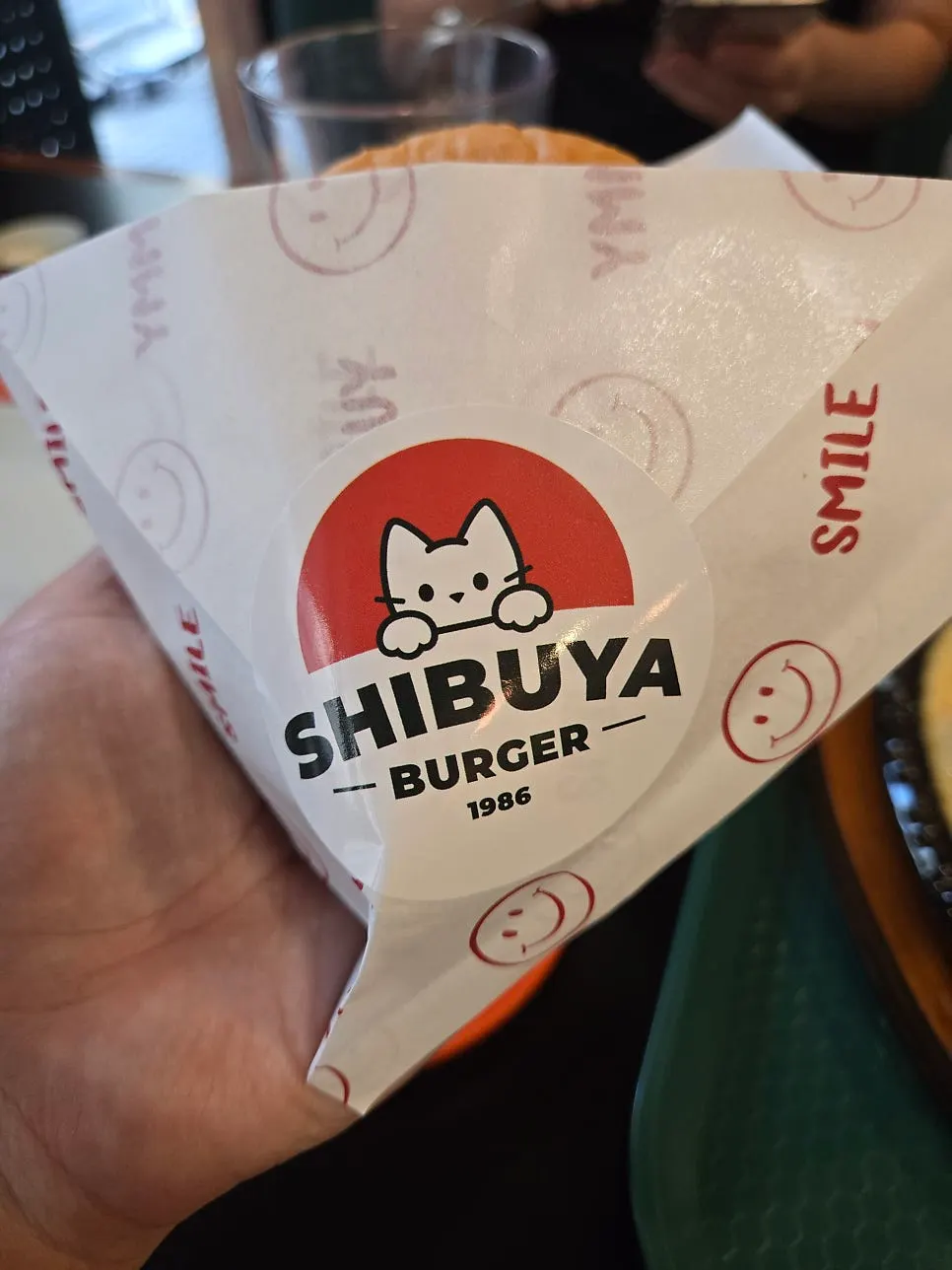 Burger wrapper printed with a character illustration
