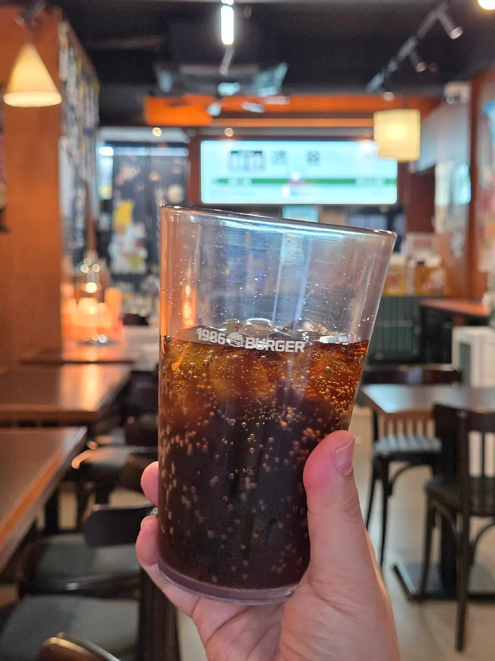 Canned cola served with the burgers