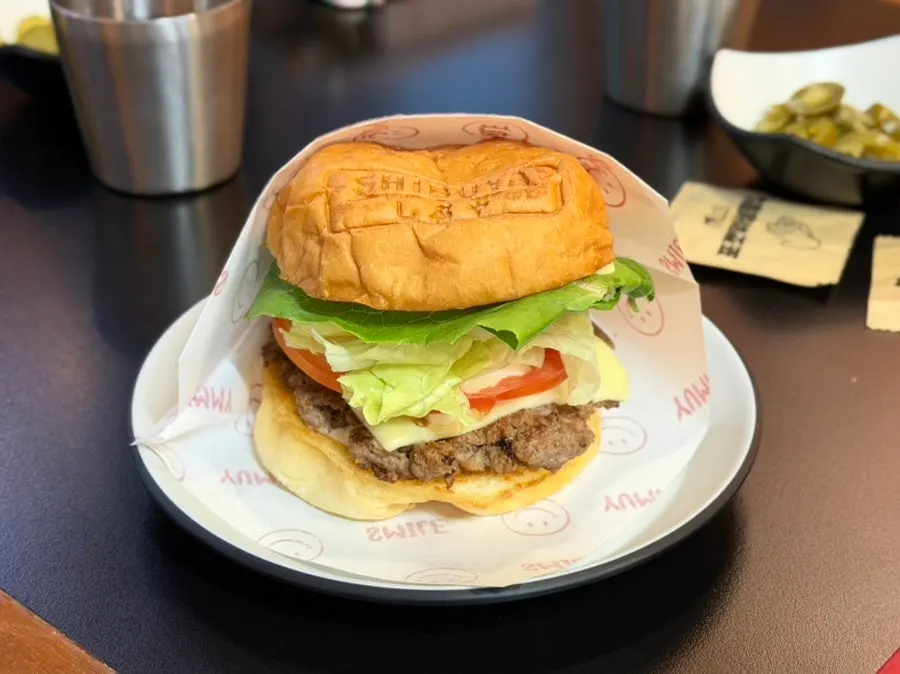 Cross-section of the Shibuya Honey Burger on a brioche bun