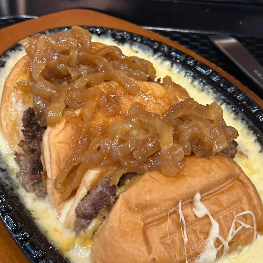 Cross-section of the red skillet cheese burger showing patty and toppings