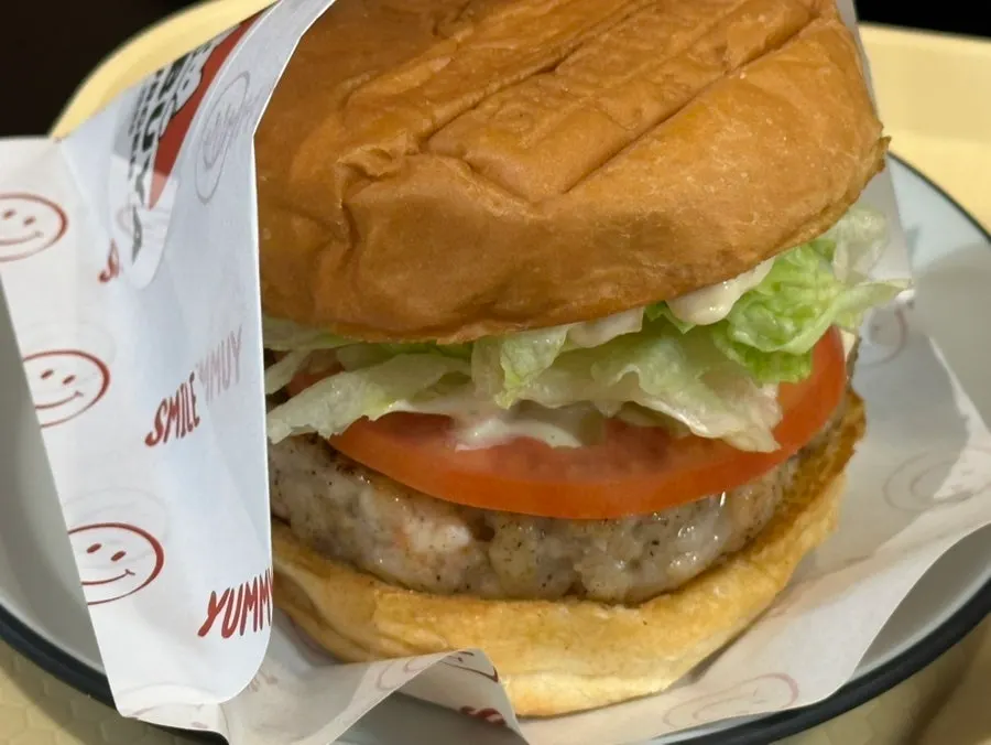 Close-up of the burger topped with pickled onion