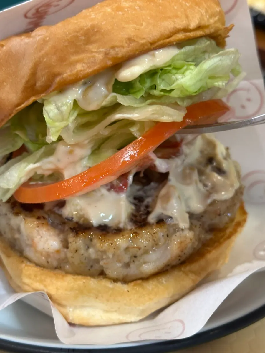 A bite taken out of the red skillet cheese burger