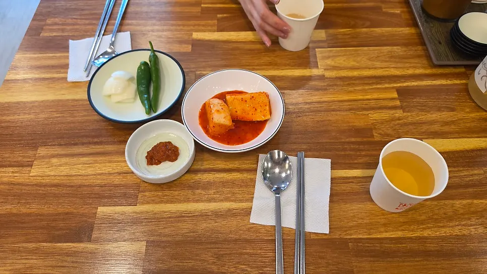 Basic side dishes of diced radish kimchi, onion, chili peppers, and ssamjang