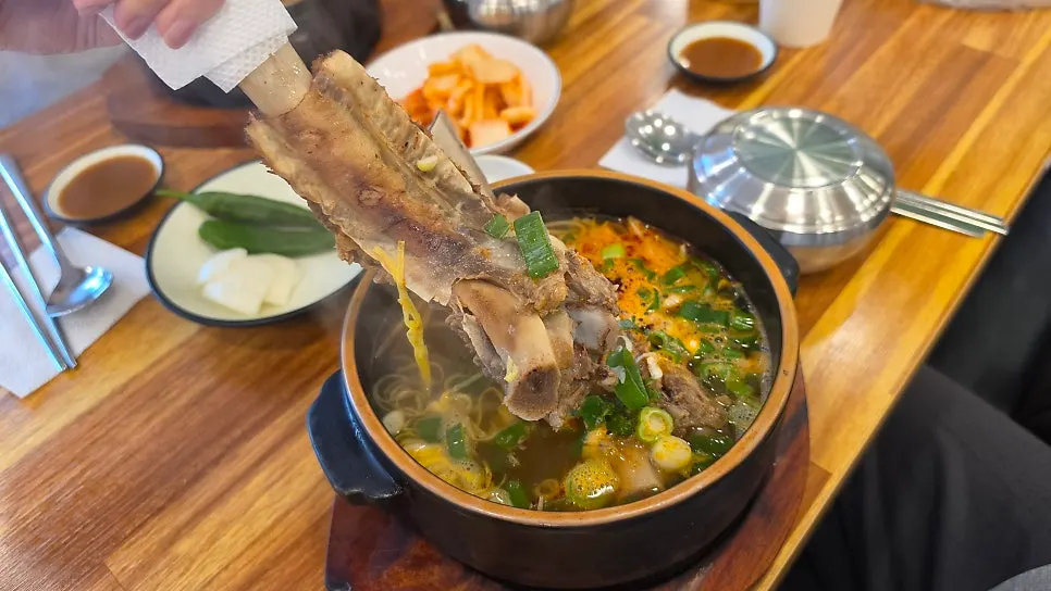 Rib bone lifted out of the spicy galbitang