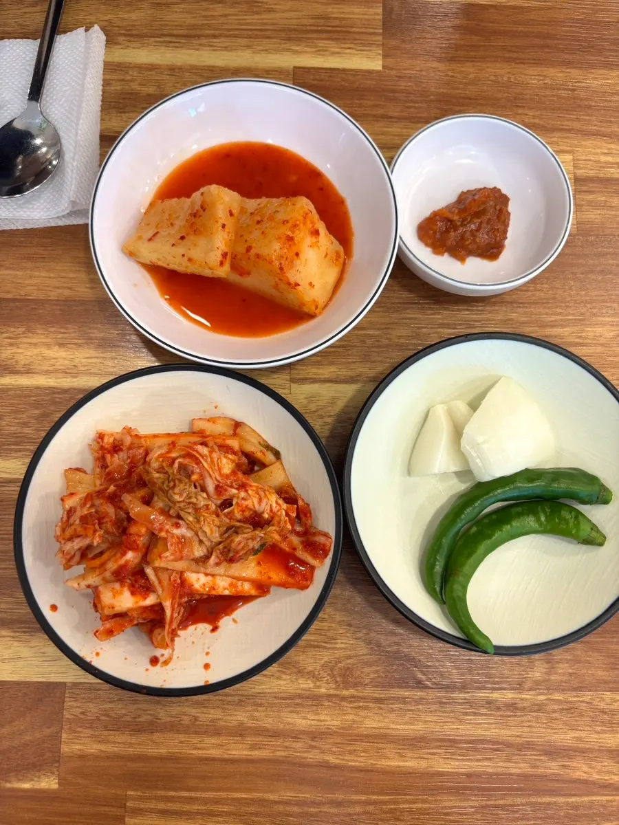Basic side dishes of napa cabbage kimchi and seokbakji