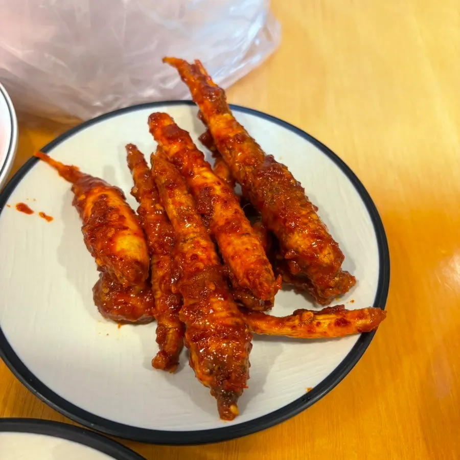 A bite of meat topped with doraji muchim