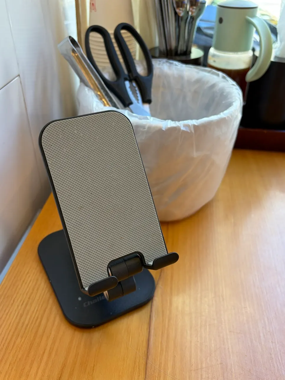 Phone stand set up at a solo seat