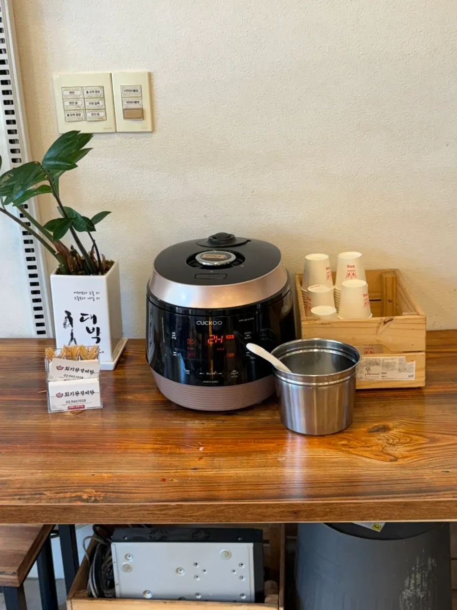 Self-serve bar with rice and side dishes