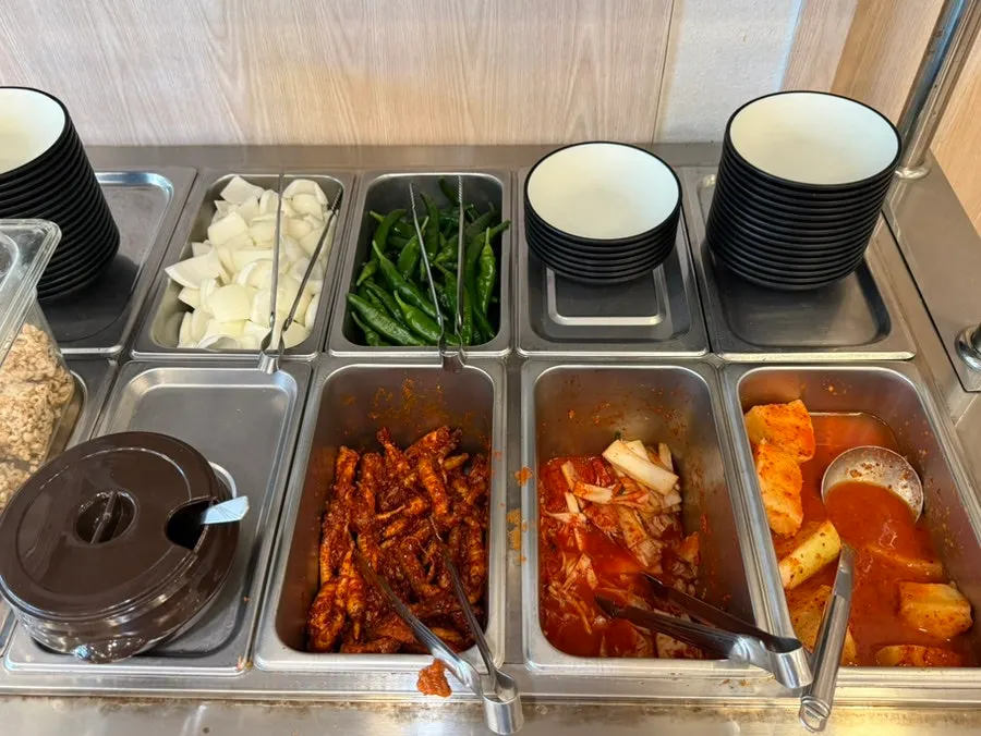 Side dishes: napa cabbage kimchi, seokbakji, and deodeok namul