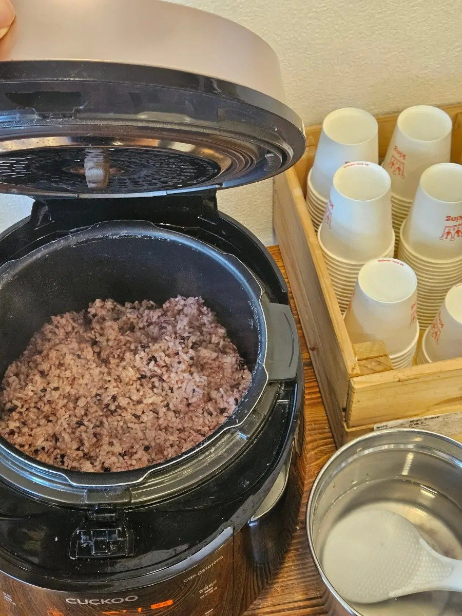 Table setting with glass noodles and a bowl of rice