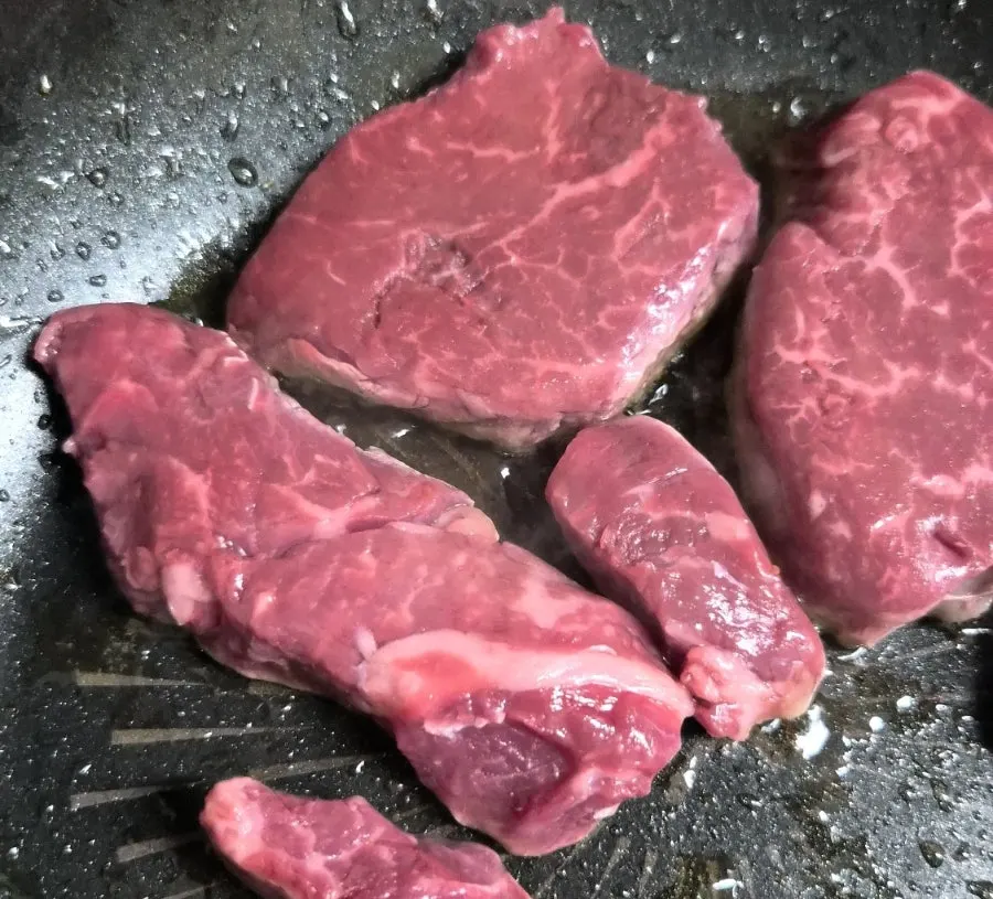 Tenderloin cooking on the grill pan