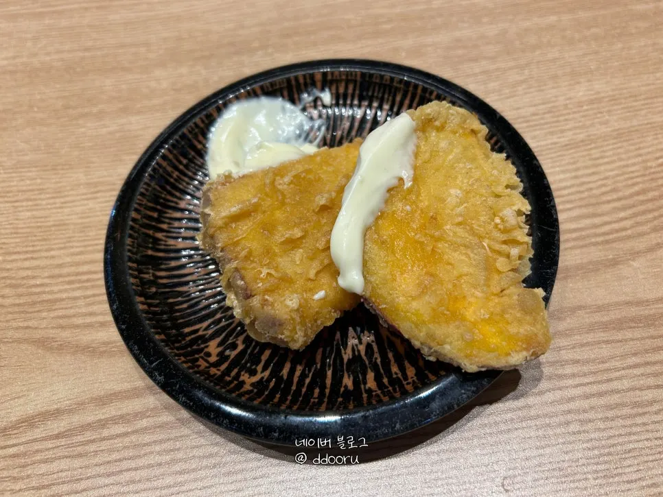 Thin sweet potato tempura served as a complimentary side