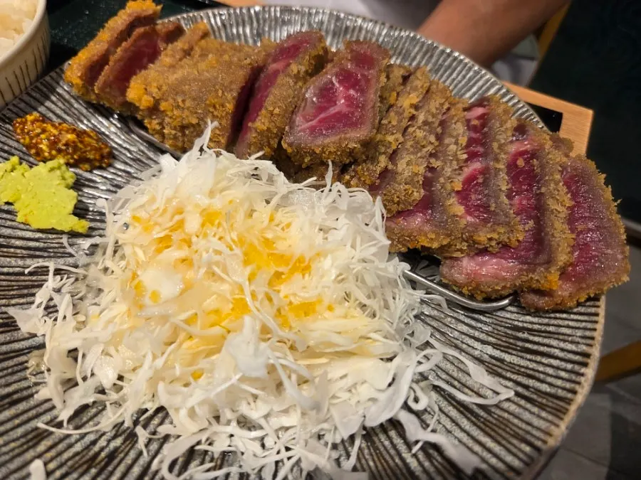 Close-up of gyukatsu showing a pink cross-section