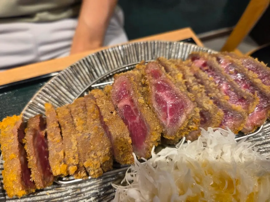 Gyukatsu being grilled on a personal hibachi