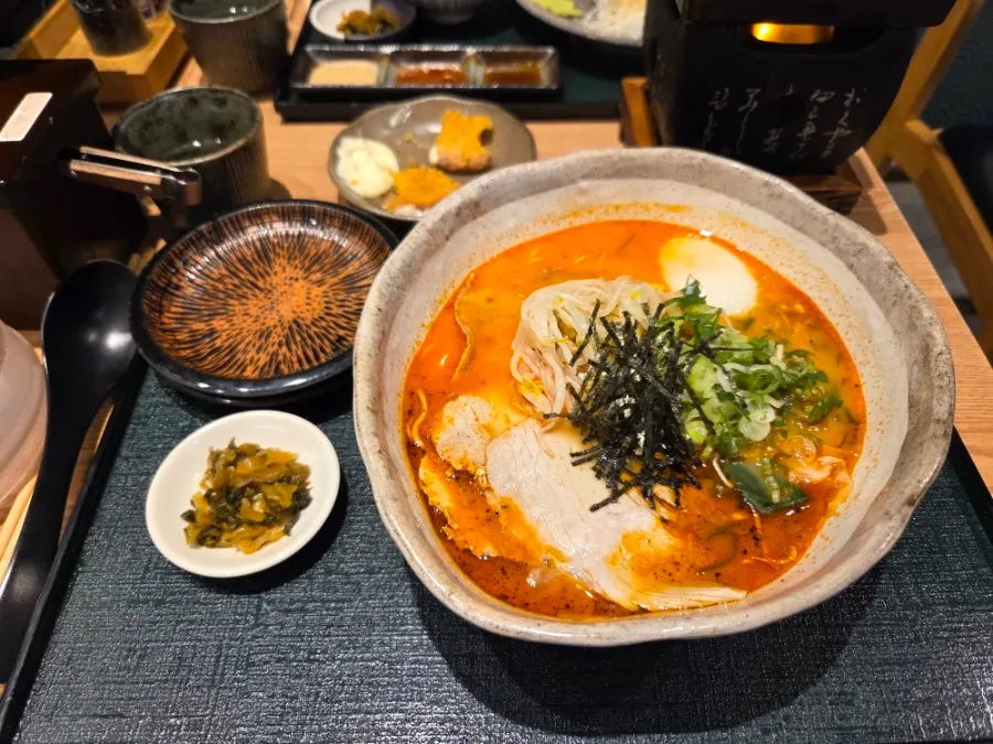 Spicy chashu ramen topped with a poached egg
