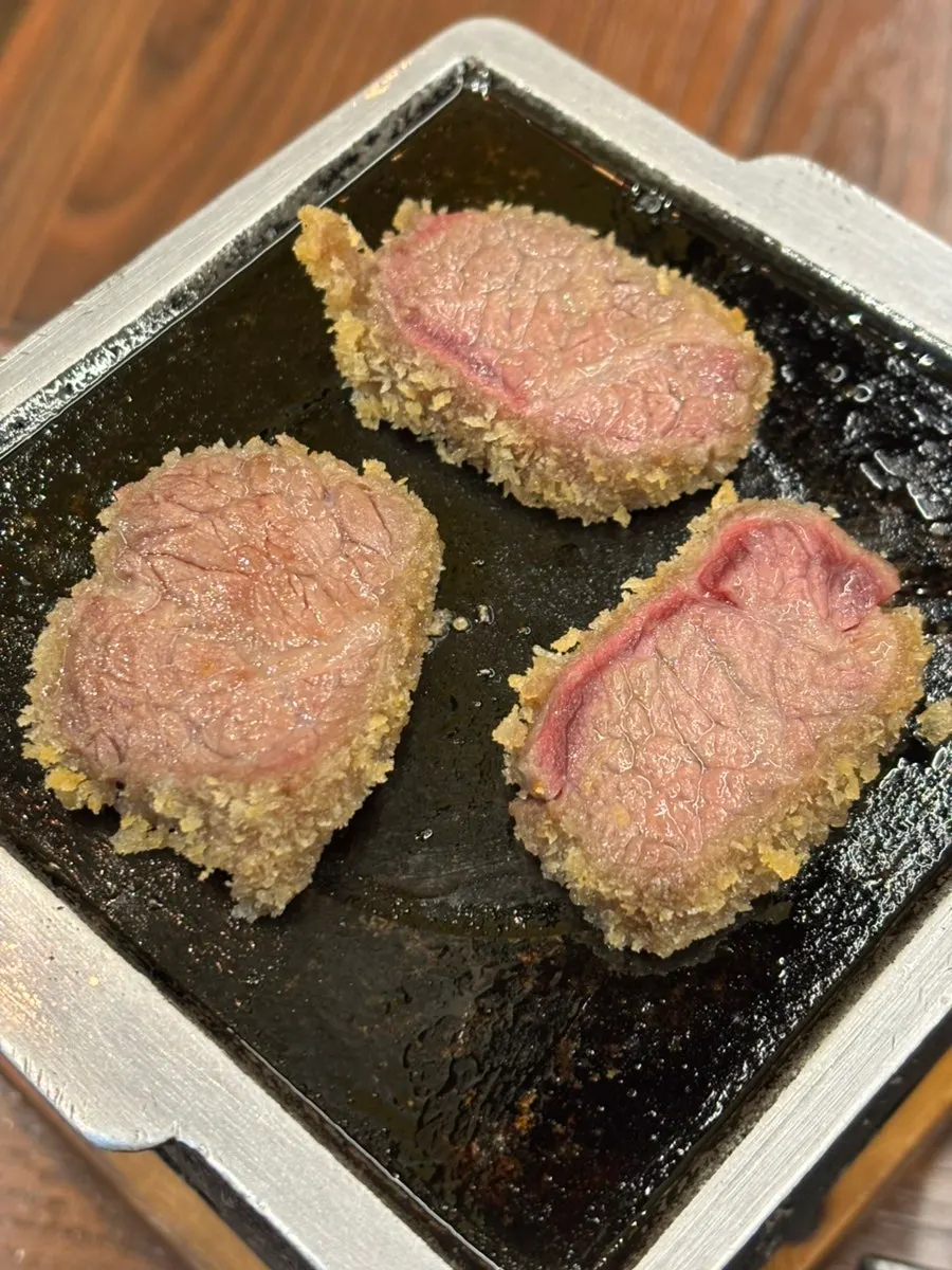 Gyukatsu being grilled on the personal charcoal grill