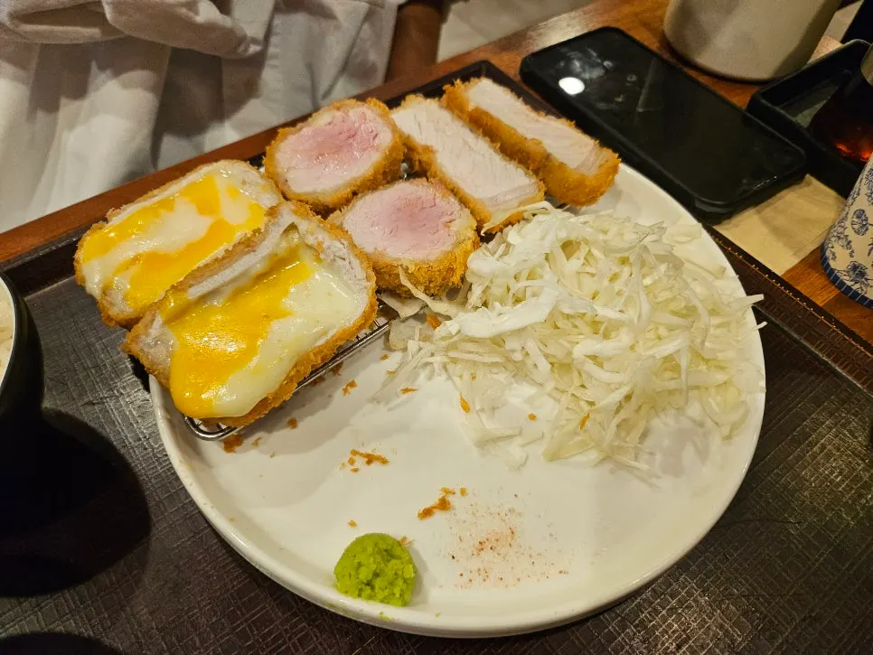 Moist meat texture visible inside the crispy batter of the cutlet platter