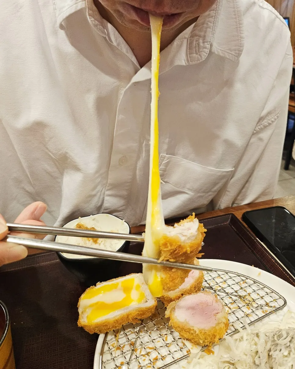 Cross-section of the cheese katsu with stretchy cheese