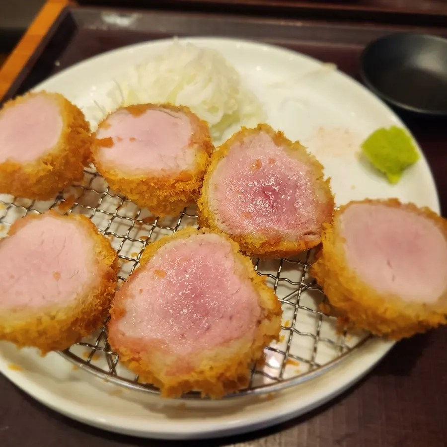 Table spread with tenderloin katsu, loin katsu, and tonkotsu ramen