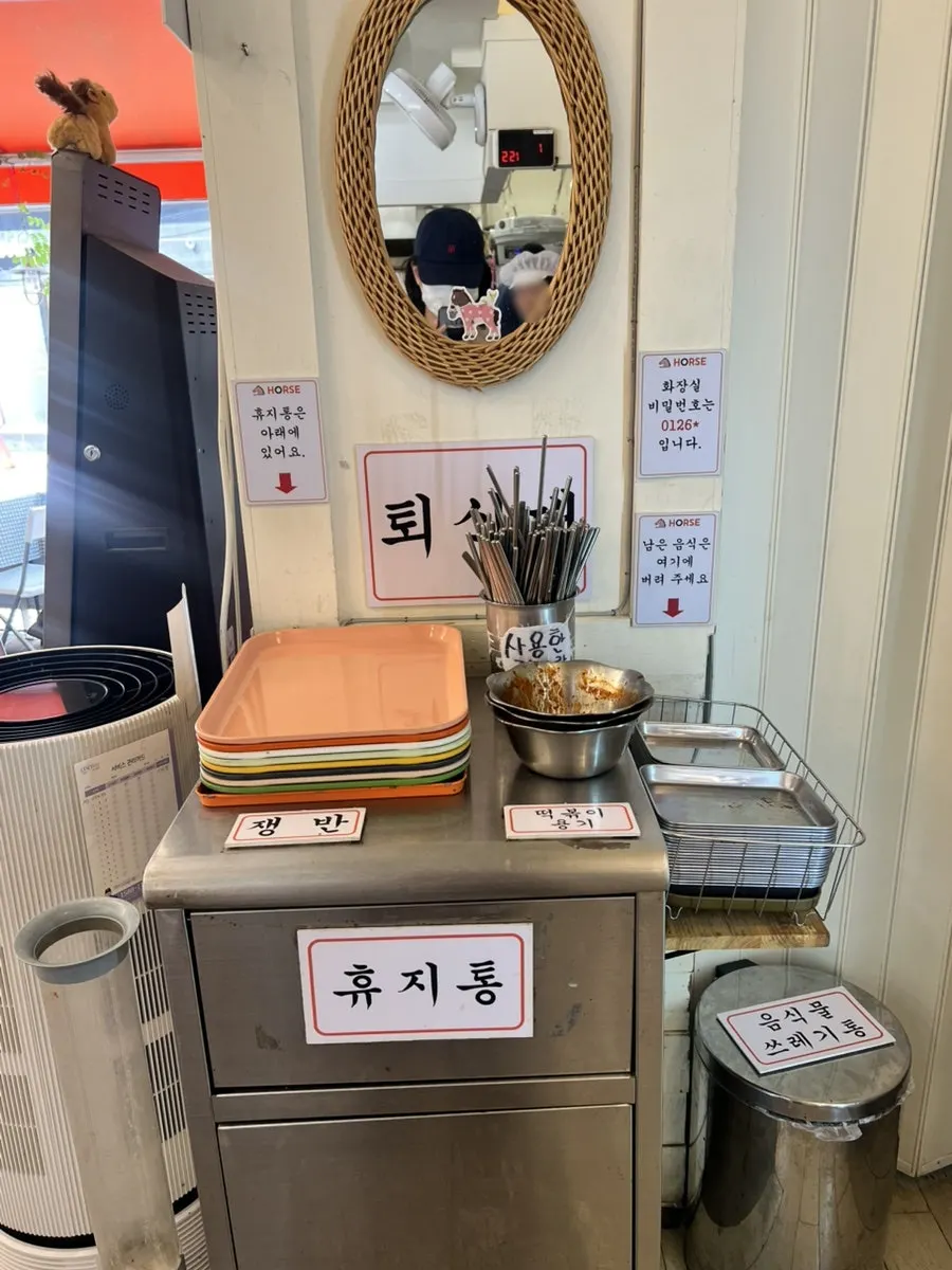 Self-serve drink fridge and table-clearing sign
