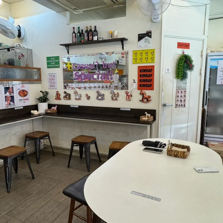 Interior of Halls Gimbap with white-toned decor