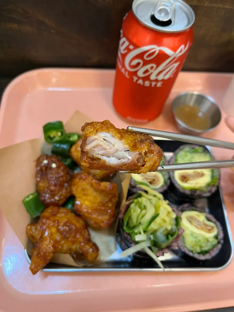 A piece of thin-battered fried chicken