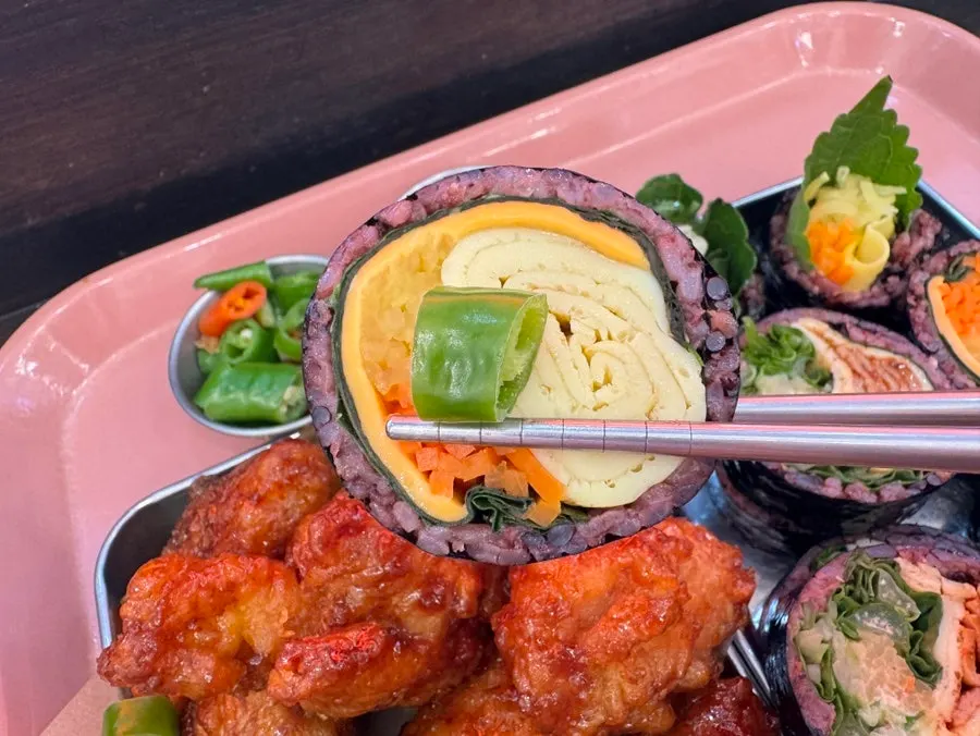 Gimbap dipped in wasabi sauce