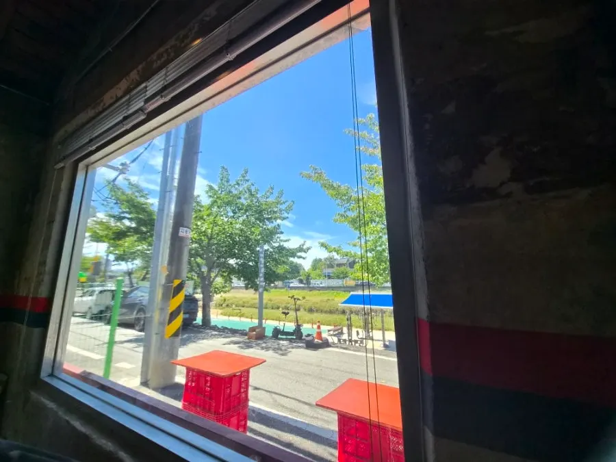 View of Soje-dong outside through the floor-to-ceiling window