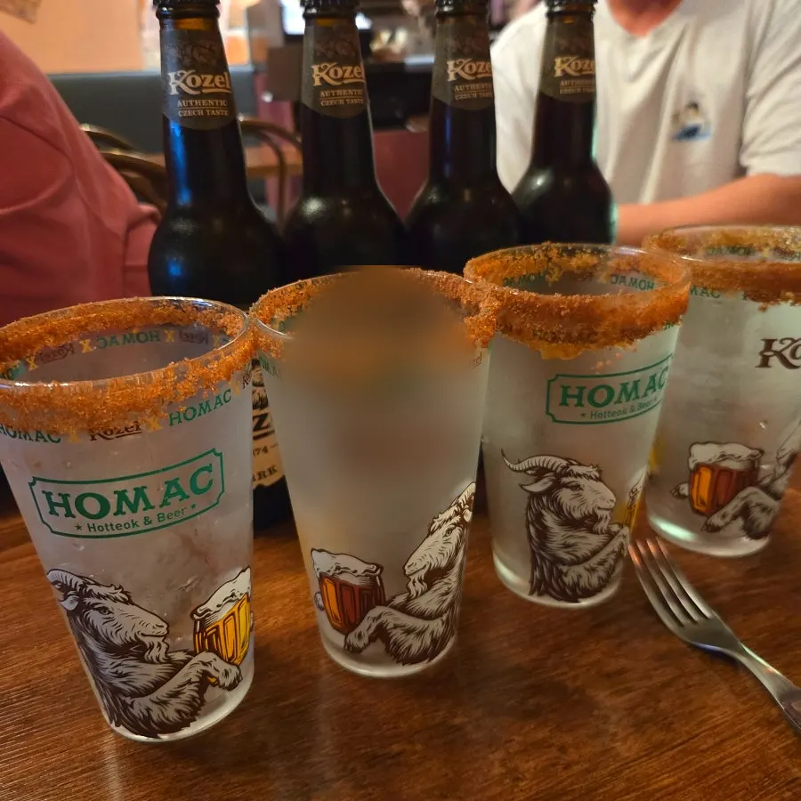 Kozel Dark bottle and glass on the table
