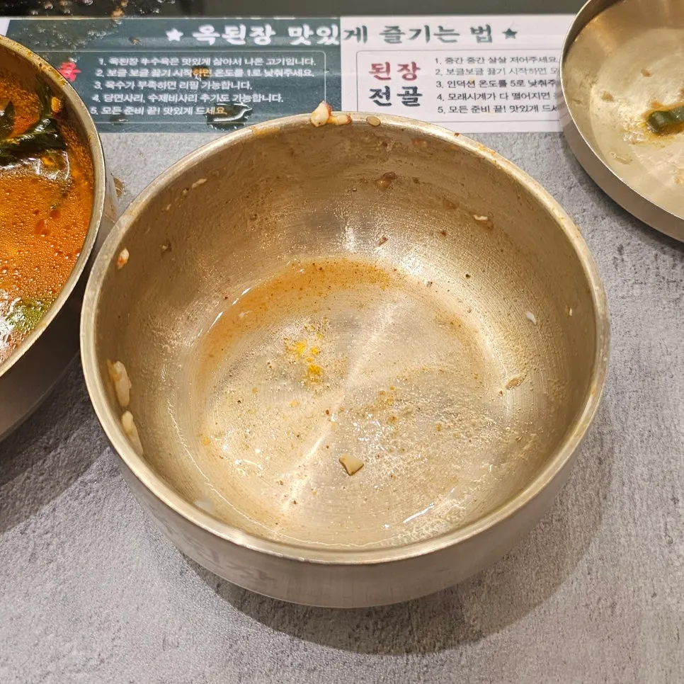 Hot pot with fully cooked onion and zucchini