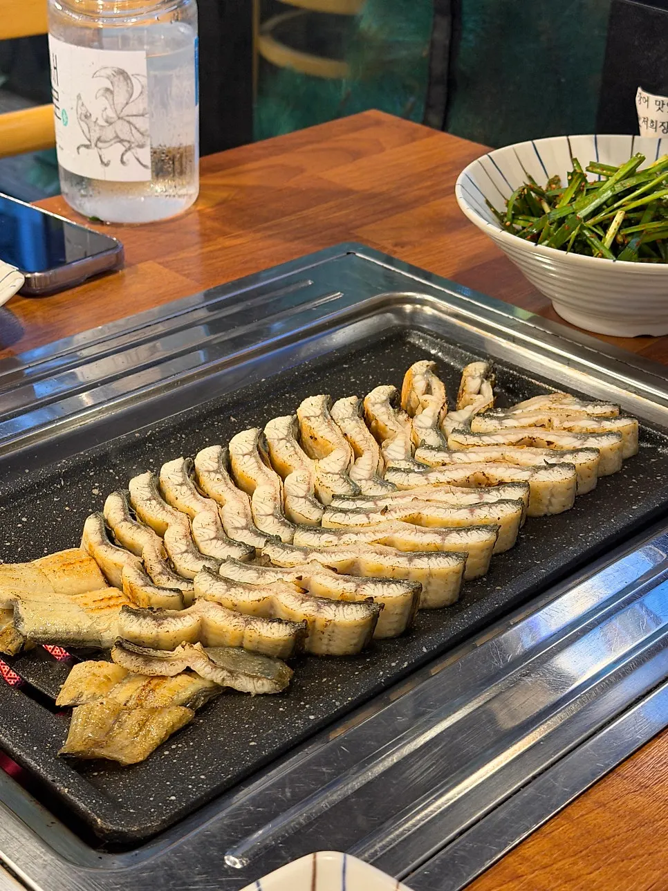 70% pre-cooked salt-grilled eel platter on the grill