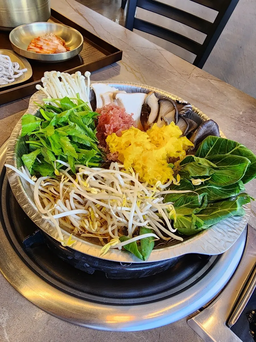 Table with basic side dishes and shabu ingredients