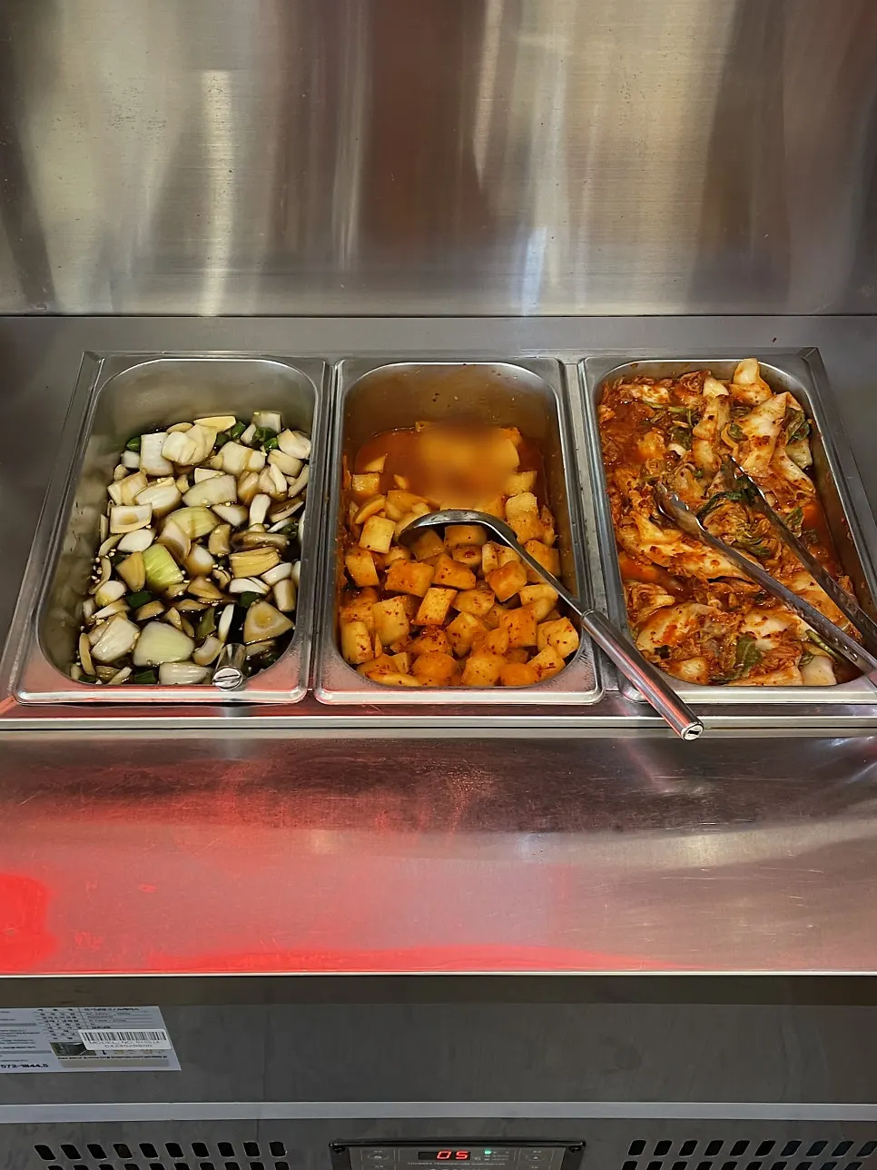 Self-serve corner with side dishes and plates