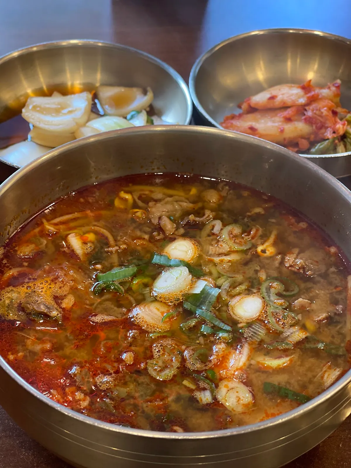 A bowl of spicy beef gukbap