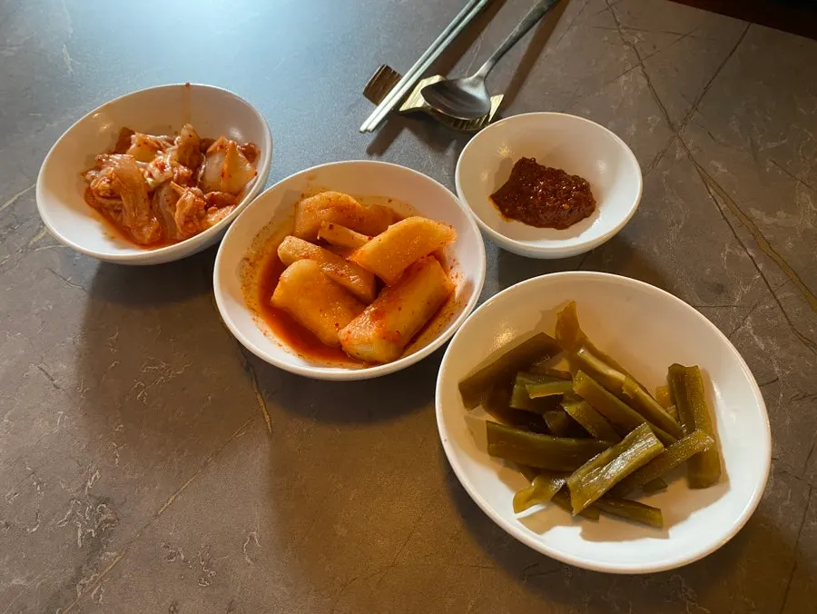 Three side dishes: kimchi, kkakdugi, and gungchae