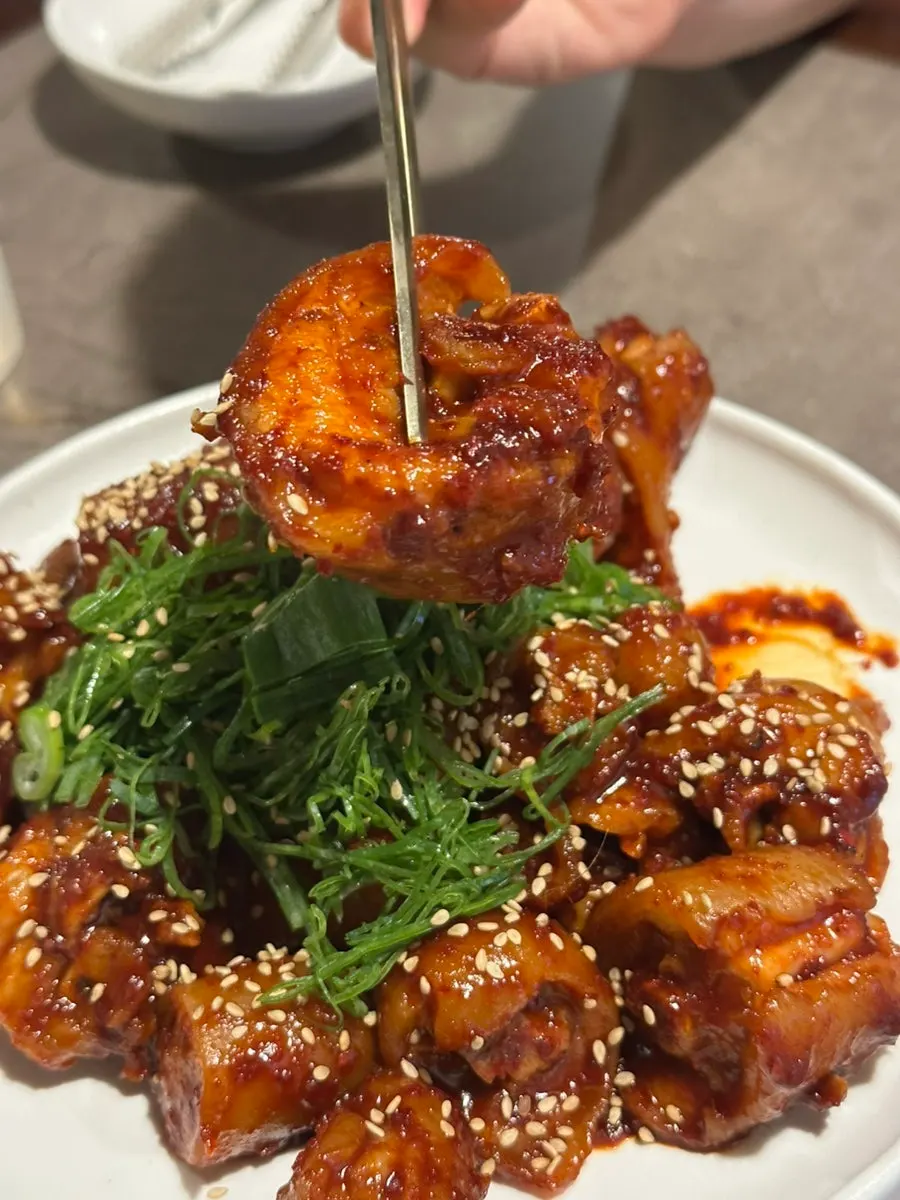 Pork tail jjim coated in spicy-sweet sauce