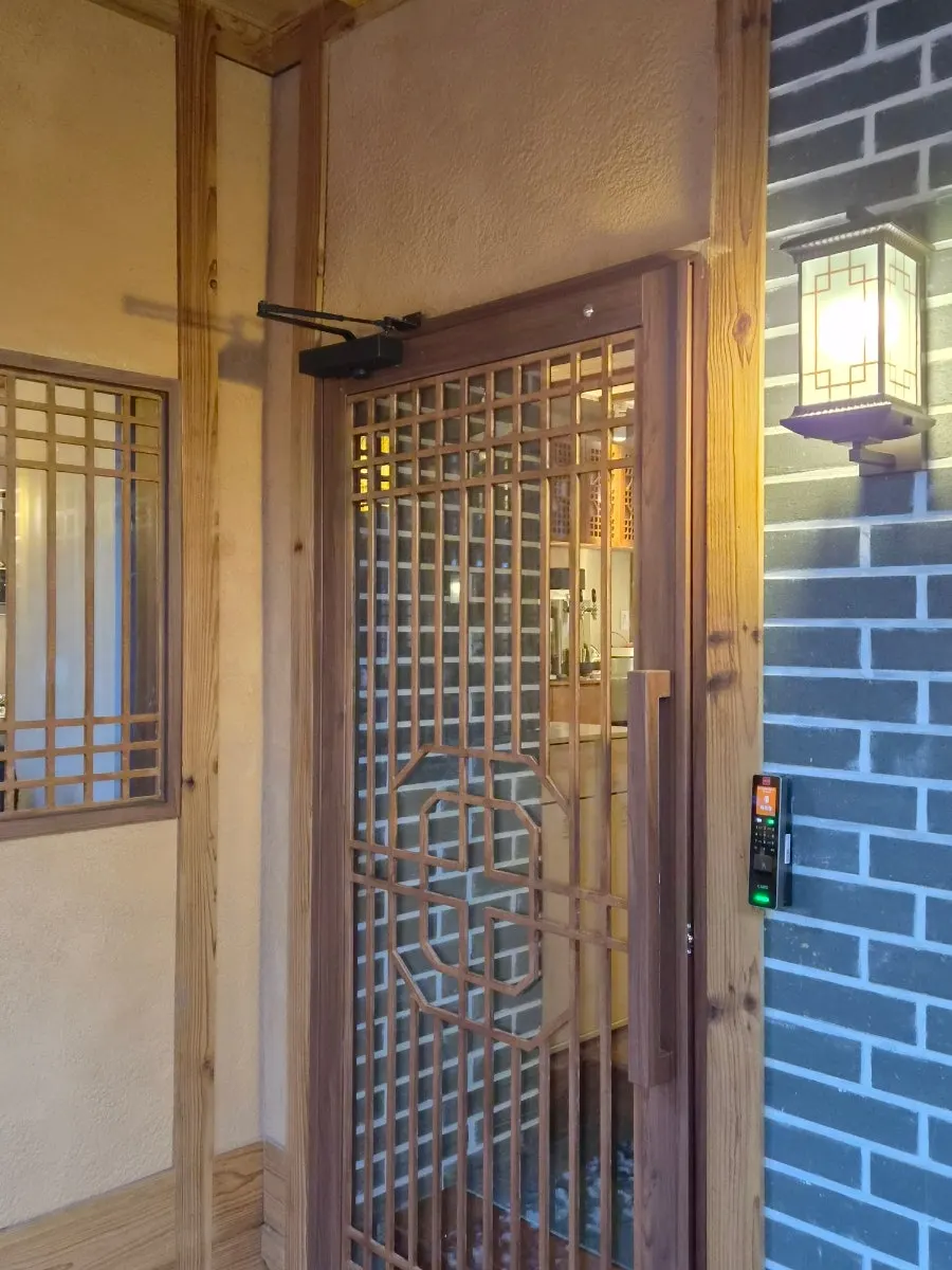 Warm lighting and hanok structure at Anok