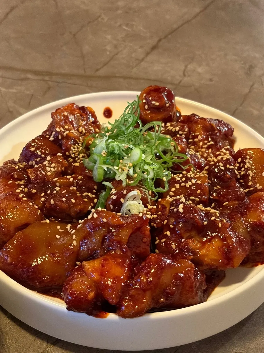 Sauce-coated pork tail jjim at Anok