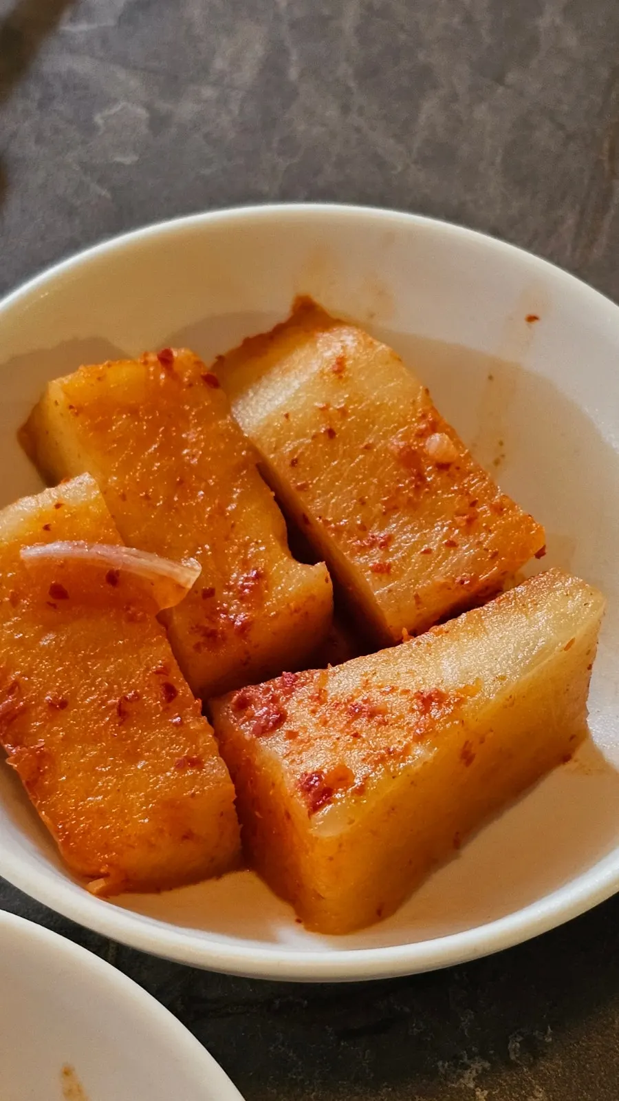 A side dish plate of kkakdugi at Anok