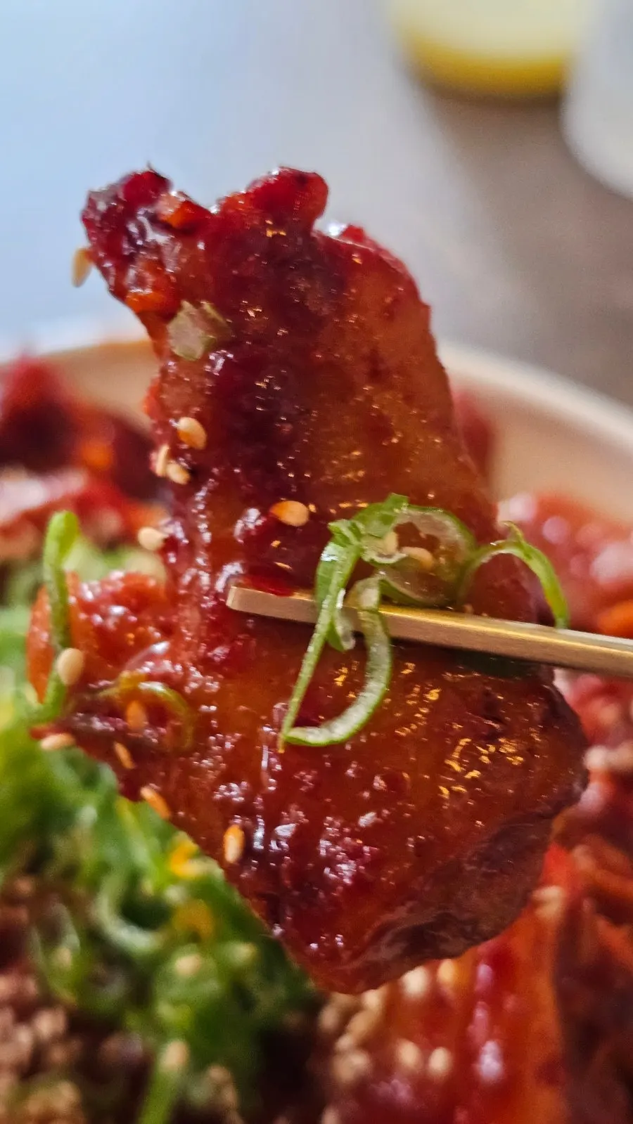 Noodles from the Pyongyang naengmyeon lifted with chopsticks