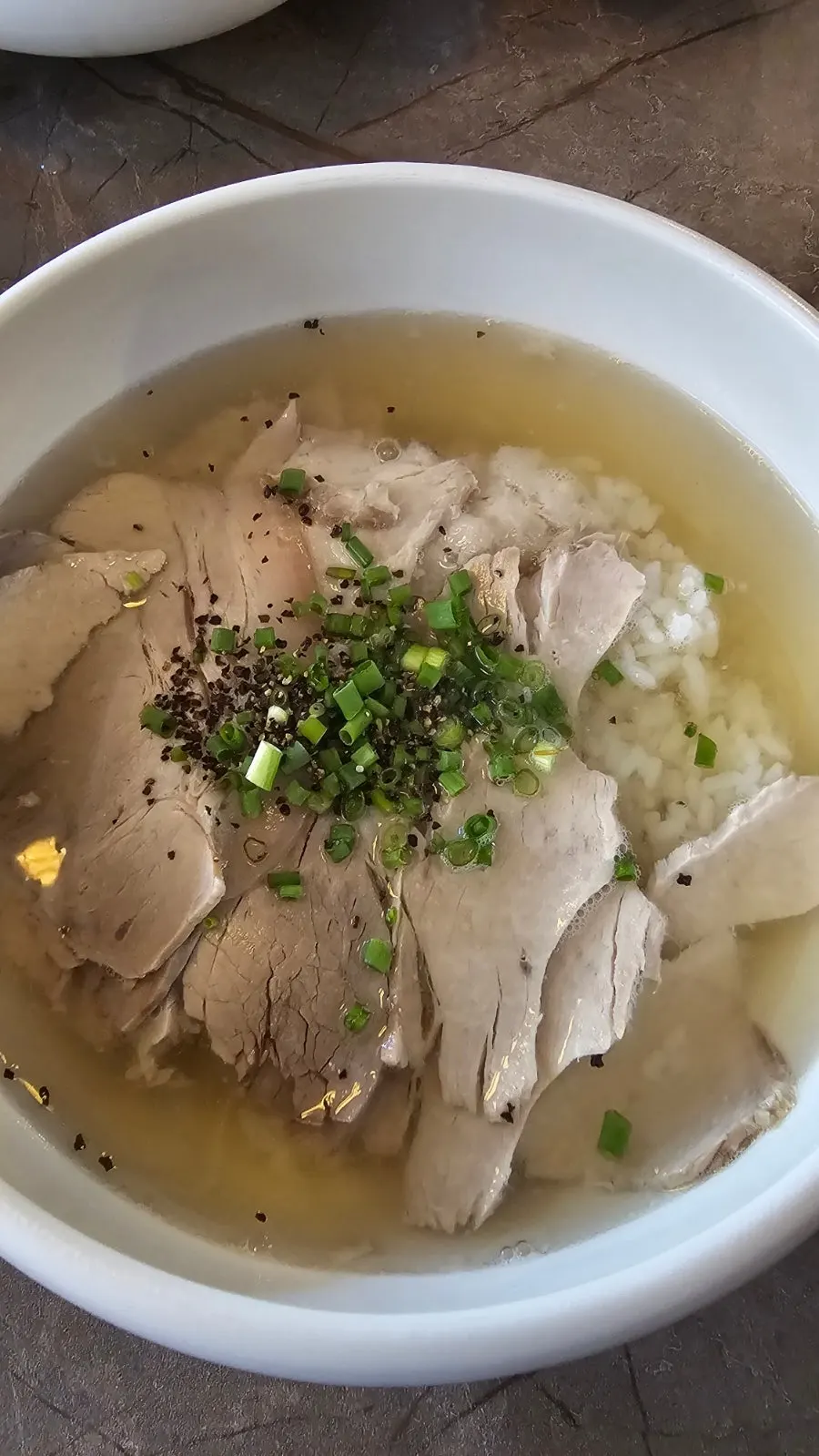 Anok's pork tail jjim topped with sauce